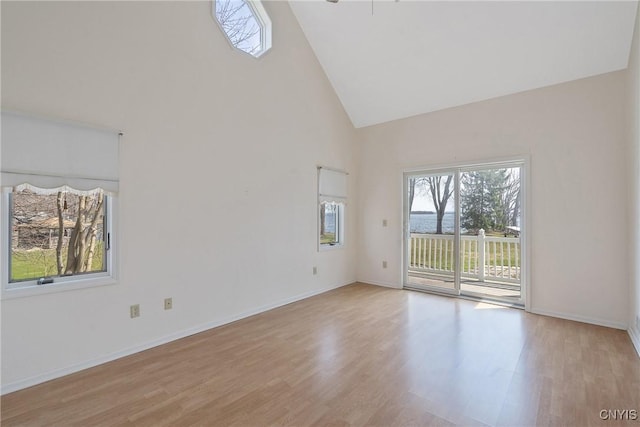 28 Wedgeworth Dr, West Monroe, NY 13167 - spare room with high vaulted ceiling, healthy amount of natural light, wood finished floors, and baseboards