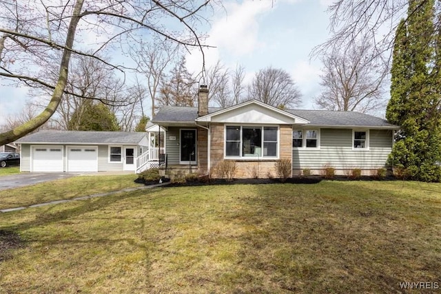 single story home with an attached garage, driveway, a chimney, and a front lawn