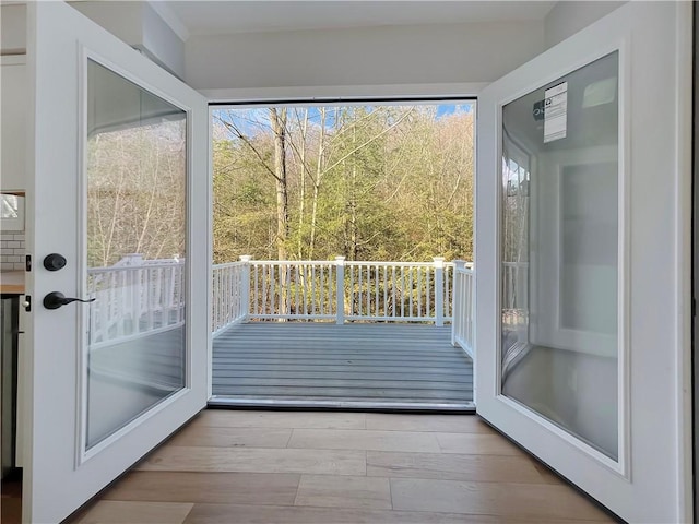 doorway to outside featuring wood finished floors