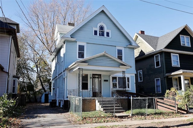 9 Renwood St, Rochester, NY 14621 - american foursquare style home with covered porch and a fenced front yard