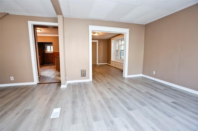 9 Renwood St, Rochester, NY 14621 - unfurnished living room with visible vents, baseboards, and light wood finished floors