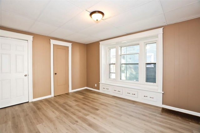 9 Renwood St, Rochester, NY 14621 - spare room with a paneled ceiling, baseboards, and light wood-style floors