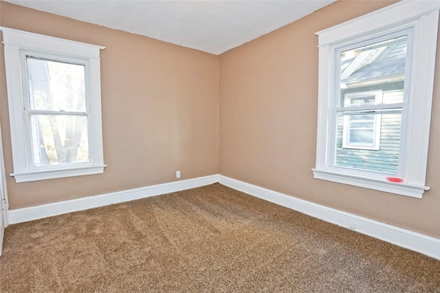 9 Renwood St, Rochester, NY 14621 - carpeted spare room featuring baseboards and plenty of natural light