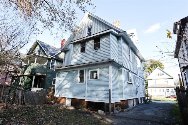 9 Renwood St, Rochester, NY 14621 - rear view of property with fence and a chimney