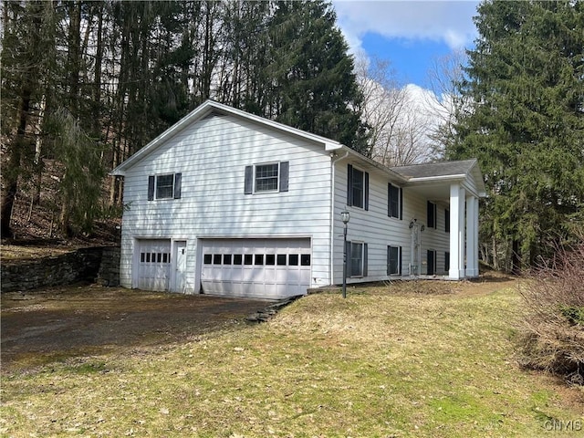 6449 W Scott Rd, Scott, NY 13077 - view of side of property with a garage, driveway, and a lawn