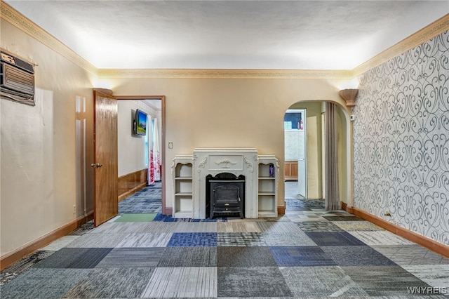 2300 Main St, Buffalo, NY 14214 - living area featuring arched walkways, a wood stove, crown molding, and baseboards