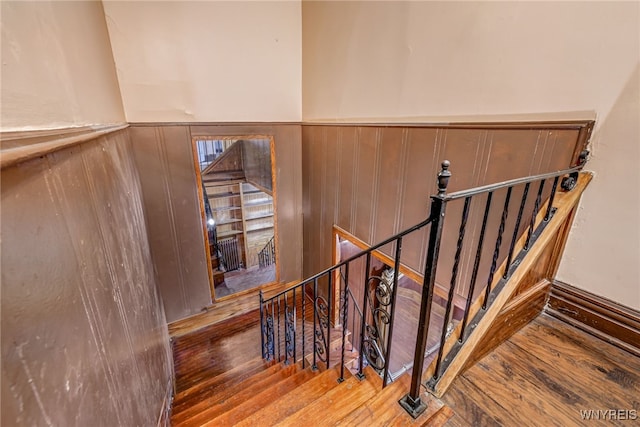 2300 Main St, Buffalo, NY 14214 - staircase with wood finished floors and a wainscoted wall