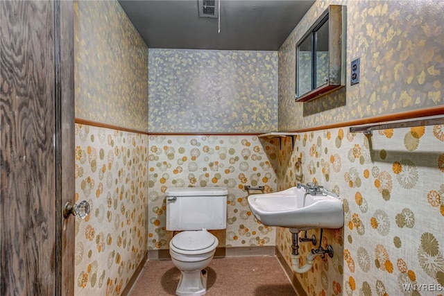 2300 Main St, Buffalo, NY 14214 - half bathroom with a sink, wallpapered walls, baseboards, toilet, and visible vents