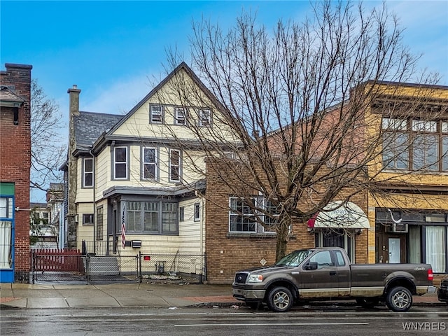 2300 Main St, Buffalo, NY 14214 - view of front of property with a gate and fence