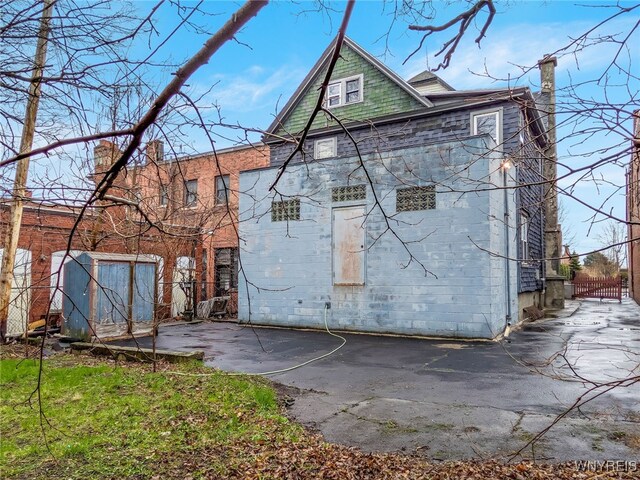 2300 Main St, Buffalo, NY 14214 - rear view of property featuring fence and a chimney