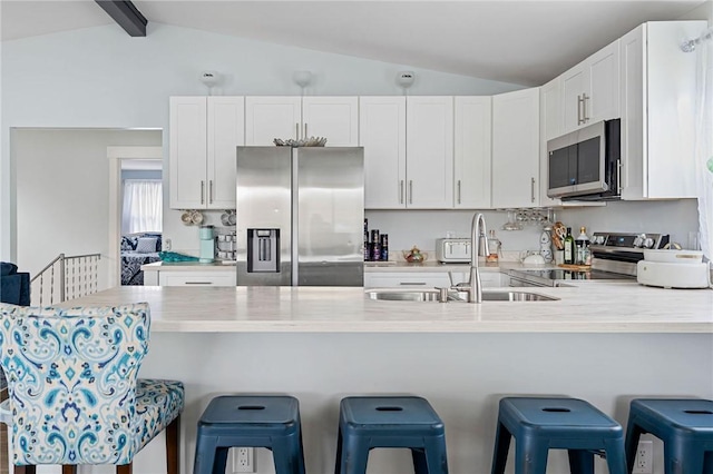 6186 Reservoir Rd, Lebanon, NY 13346 - kitchen with stainless steel appliances, a sink, a peninsula, light countertops, and white cabinets