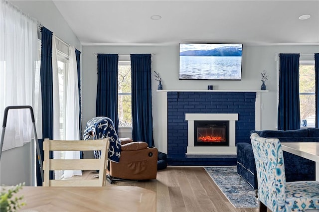 6186 Reservoir Rd, Lebanon, NY 13346 - living room with wood finished floors, a brick fireplace, and vaulted ceiling