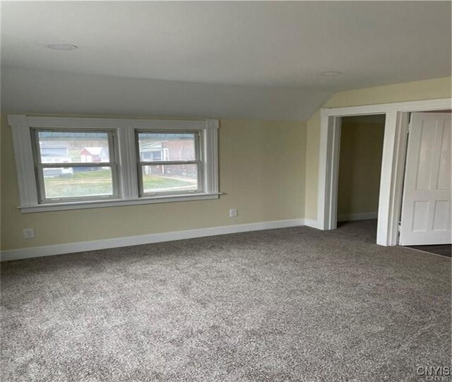 622 Fulton St, Wilna, NY 13619 - carpeted spare room with plenty of natural light, vaulted ceiling, and baseboards
