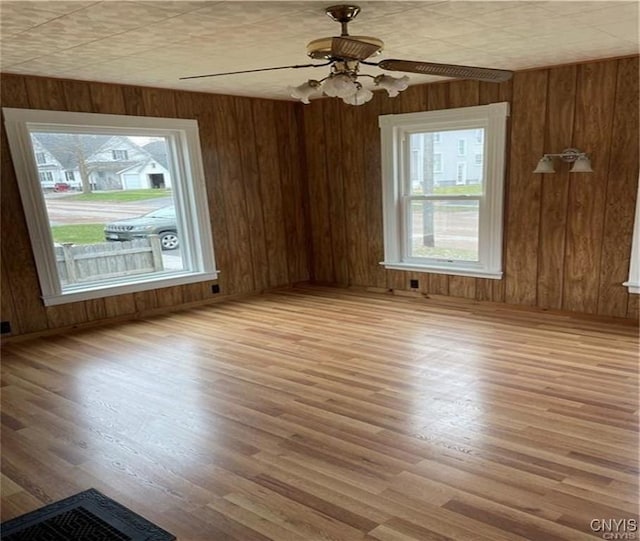 622 Fulton St, Wilna, NY 13619 - spare room with wood walls and wood finished floors