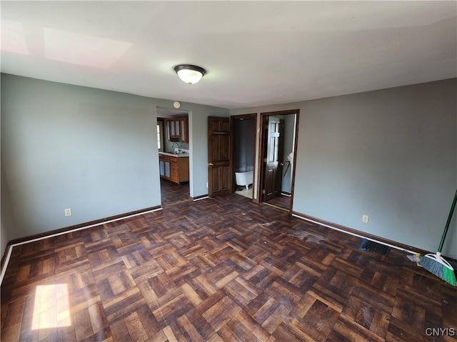 903 Milton Ave, Syracuse, NY 13204 - spare room featuring a sink and baseboards