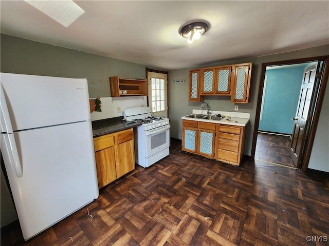 903 Milton Ave, Syracuse, NY 13204 - kitchen with a sink, brown cabinetry, open shelves, and white appliances