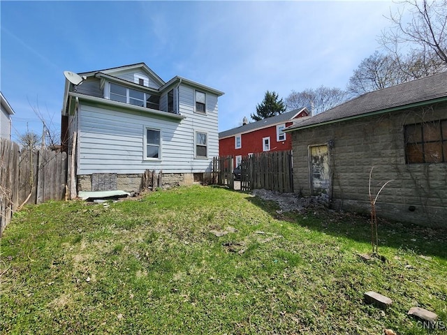 903 Milton Ave, Syracuse, NY 13204 - rear view of property with fence and a lawn