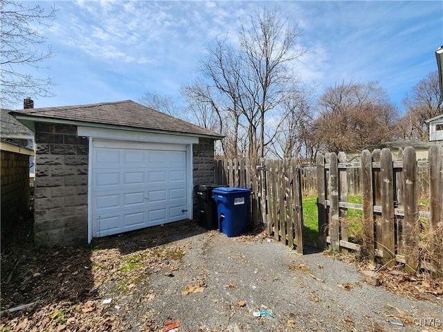 903 Milton Ave, Syracuse, NY 13204 - detached garage featuring aphalt driveway and fence
