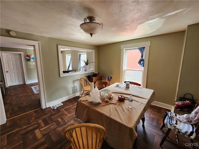 903 Milton Ave, Syracuse, NY 13204 - dining area with a wealth of natural light, baseboards, and a textured ceiling