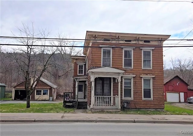 italianate home with an outbuilding