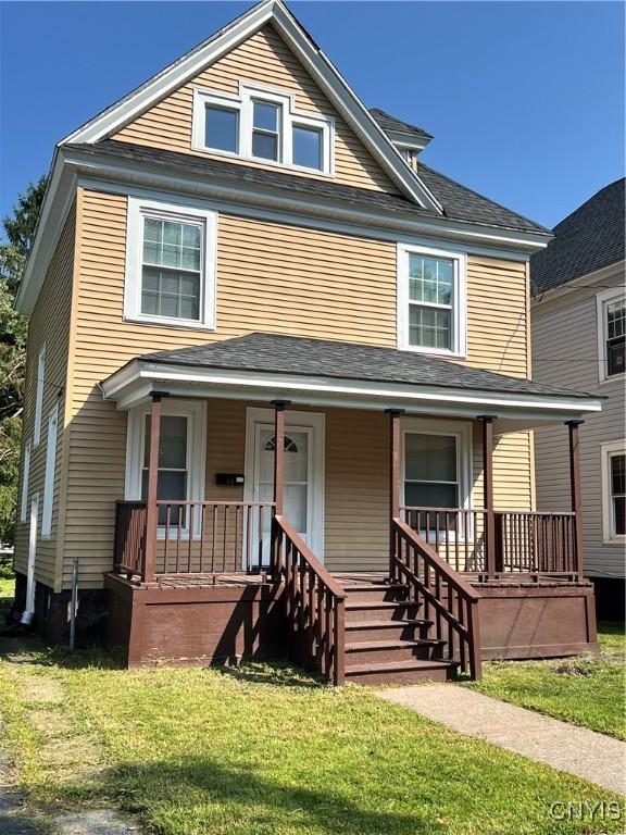 418 W Ostrander Ave, Syracuse, NY 13205 - american foursquare style home with a front yard and a porch