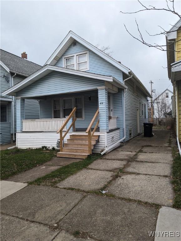 83 Custer St, Buffalo, NY 14214 - view of front of property featuring a porch and driveway