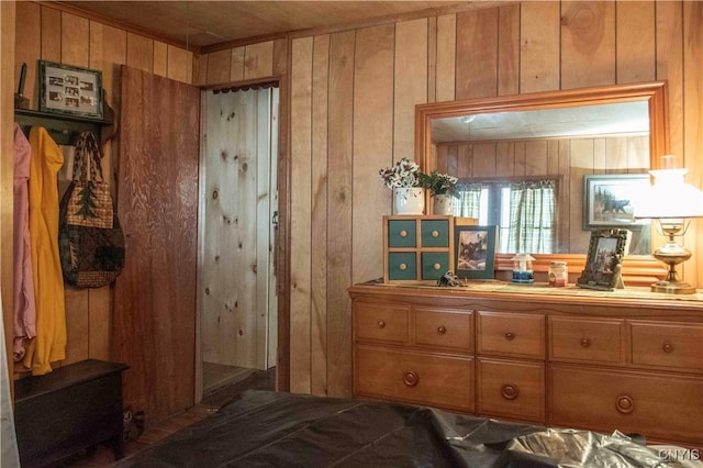 bedroom with wooden walls