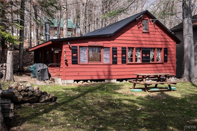view of property exterior with a yard
