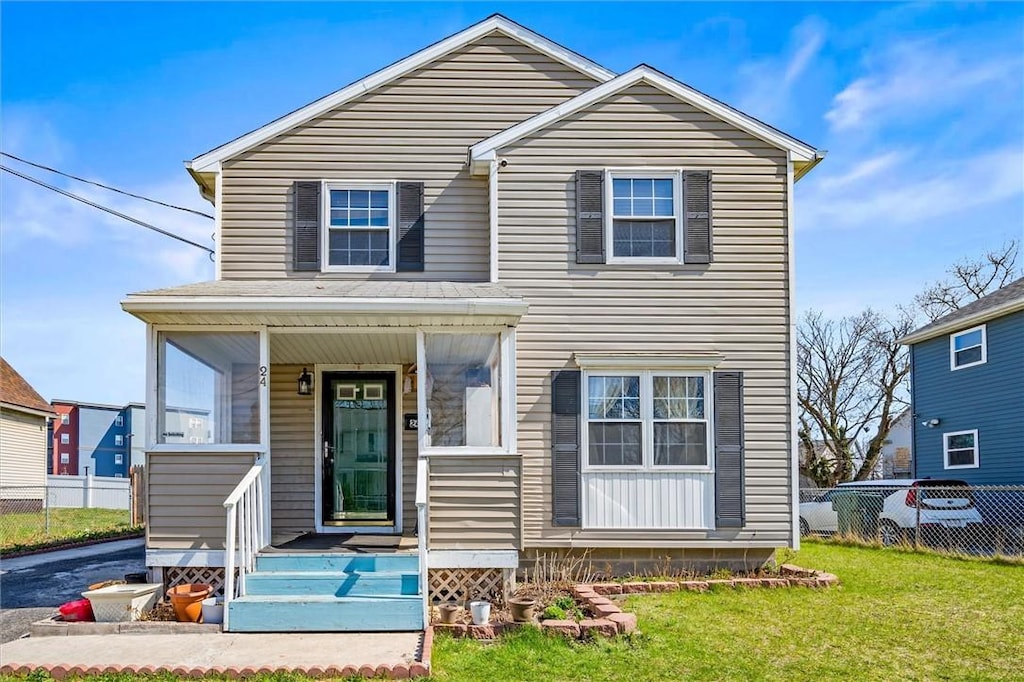 24 Cuba Pl, Rochester, NY 14605 - traditional-style home featuring a front yard, fence, and covered porch