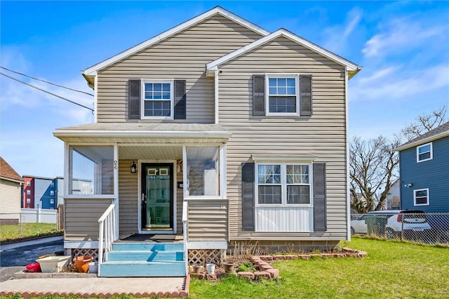 24 Cuba Pl, Rochester, NY 14605 - traditional-style home featuring a front yard, fence, and covered porch