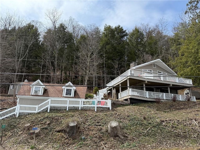 6761 State Highway 80, Otsego, NY 13326 - rear view of property featuring a deck and a forest view