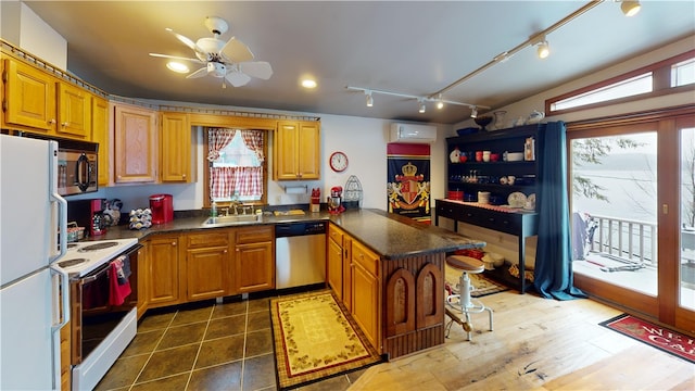 6761 State Highway 80, Otsego, NY 13326 - kitchen with appliances with stainless steel finishes, a sink, a peninsula, and dark countertops