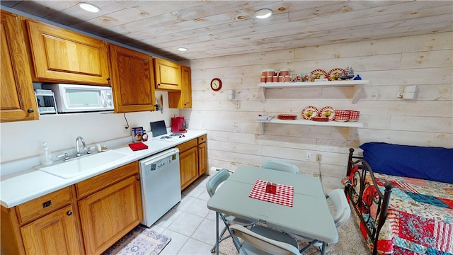 6761 State Highway 80, Otsego, NY 13326 - kitchen with white appliances, a sink, light countertops, wood ceiling, and wood walls