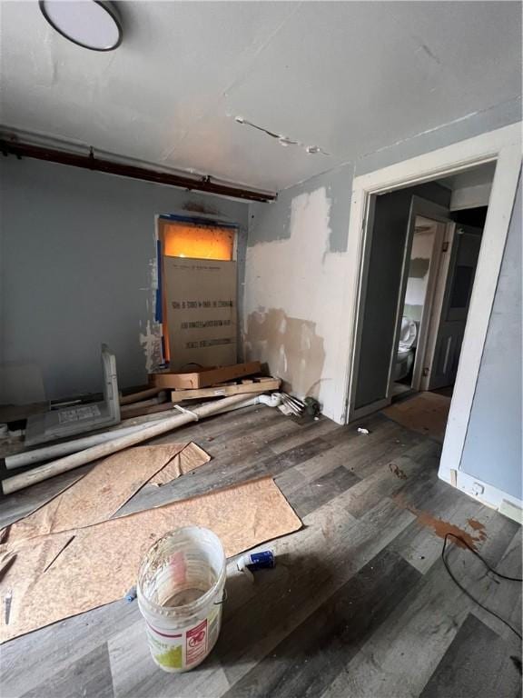 spare room featuring wood finished floors