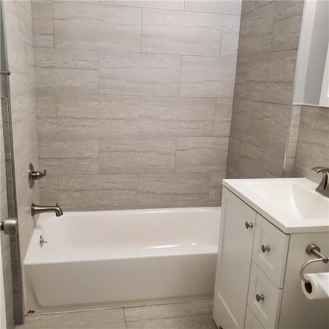 bathroom with vanity and  shower combination