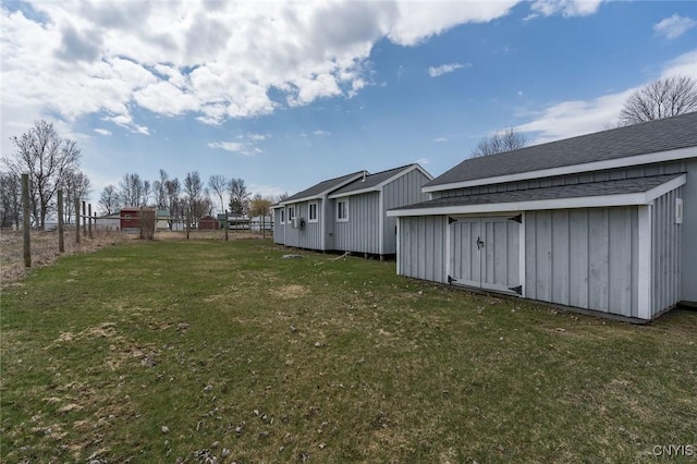 27180 Montonna Shores Rd N, Lyme, NY 13693 - view of yard with fence, an outdoor structure, and a storage shed