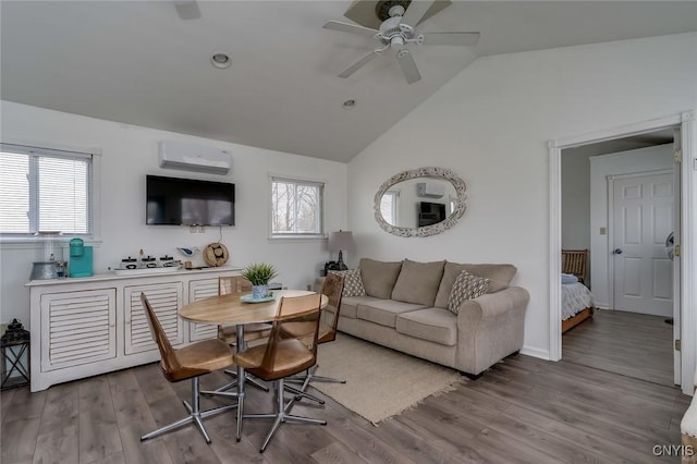 27180 Montonna Shores Rd N, Lyme, NY 13693 - living area featuring lofted ceiling, a wealth of natural light, a ceiling fan, and a wall mounted AC