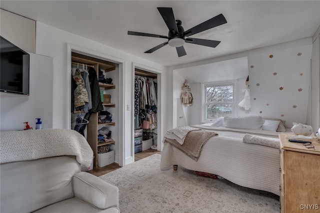 bedroom featuring wood finished floors and ceiling fan