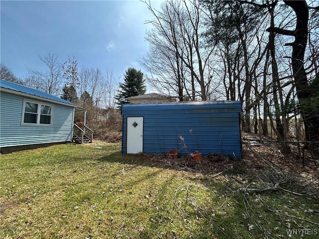 254-256 Bird Ave, Sidney, NY 13838 - view of green lawn with an outdoor structure and a storage shed