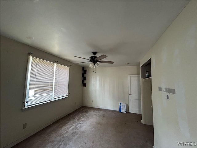 spare room featuring a ceiling fan