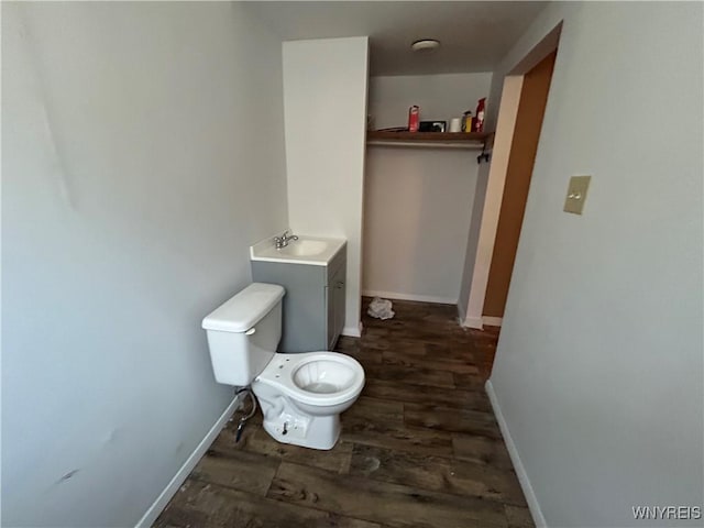 254-256 Bird Ave, Sidney, NY 13838 - half bathroom with wood finished floors, a sink, toilet, and baseboards
