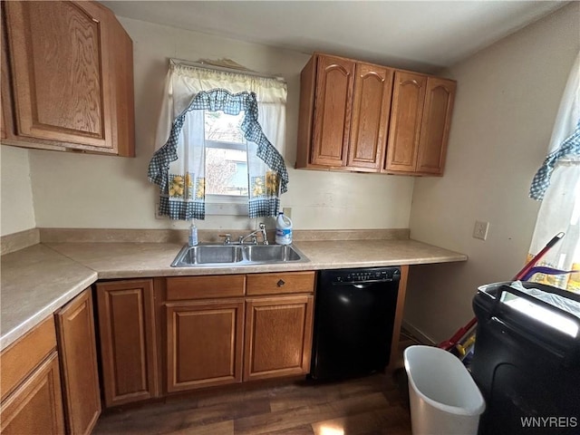 kitchen featuring dark wood-style floors, a sink, light countertops, brown cabinetry, and dishwasher