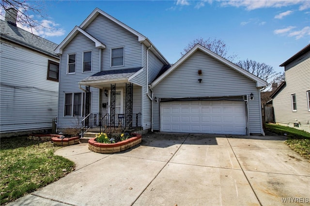 traditional-style home featuring an attached garage and concrete driveway