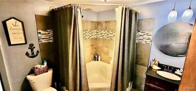 bathroom featuring shower / bathtub combination with curtain, vanity, and toilet
