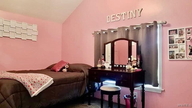 carpeted bedroom featuring vaulted ceiling