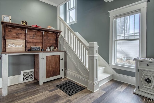 22 Bridge St, Champion, NY 13619 - stairway with visible vents, wainscoting, and wood finished floors