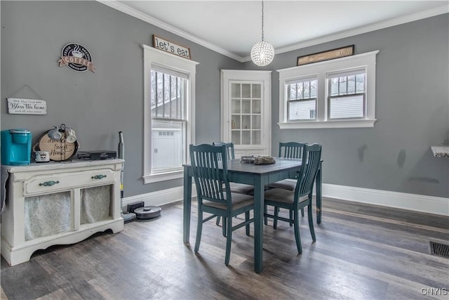 22 Bridge St, Champion, NY 13619 - dining room with visible vents, crown molding, baseboards, and dark wood-style flooring