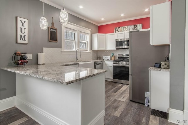 22 Bridge St, Champion, NY 13619 - kitchen featuring a peninsula, white cabinetry, dark wood-type flooring, and stainless steel appliances