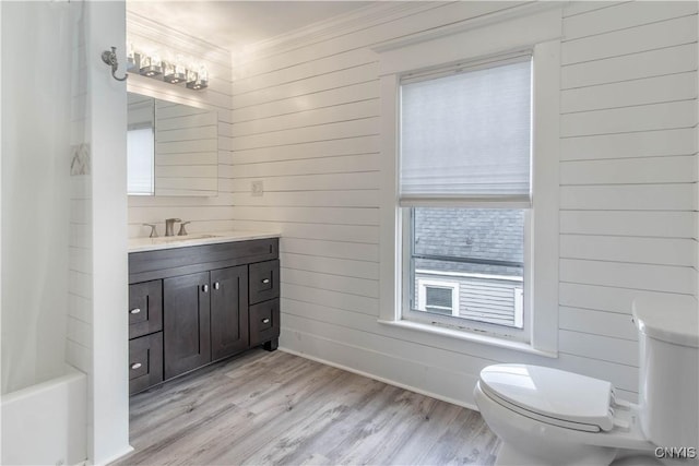 22 Bridge St, Champion, NY 13619 - full bath with wooden walls, wood finished floors, toilet, and crown molding