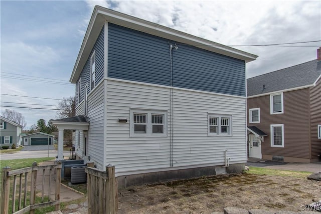22 Bridge St, Champion, NY 13619 - back of property with central air condition unit, entry steps, and fence